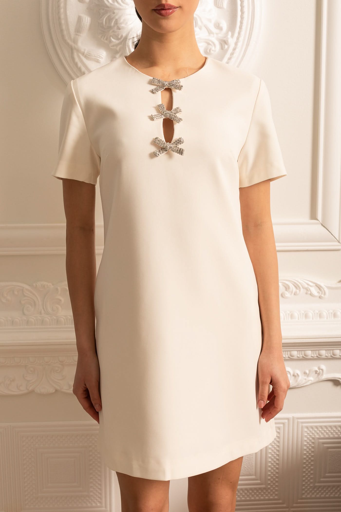 White Short Sleeved Mini Dress With Sparkling Neckline Bows