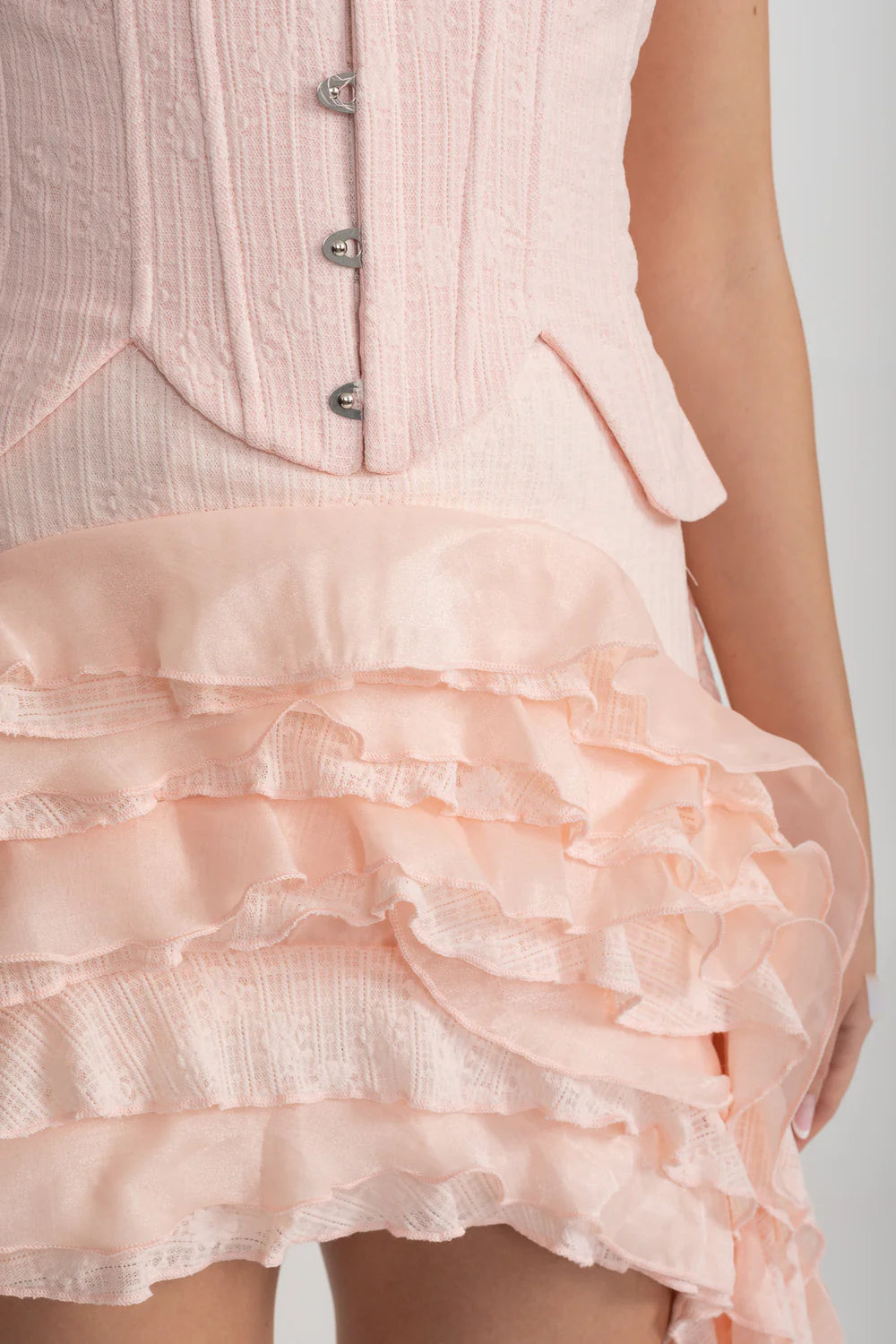 Vintage Inspired Corset Dress With Ruched Bustier And Flowing Ruffled Side Details - Pink
