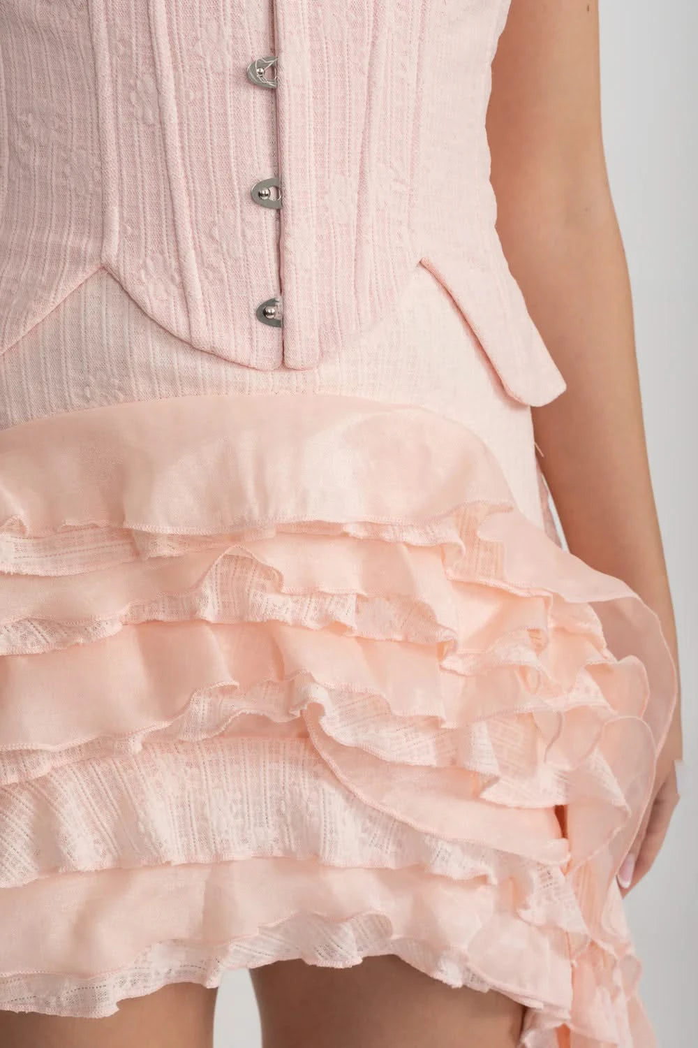 Vintage Inspired Corset Dress With Ruched Bustier And Flowing Ruffled Side Details - Pink