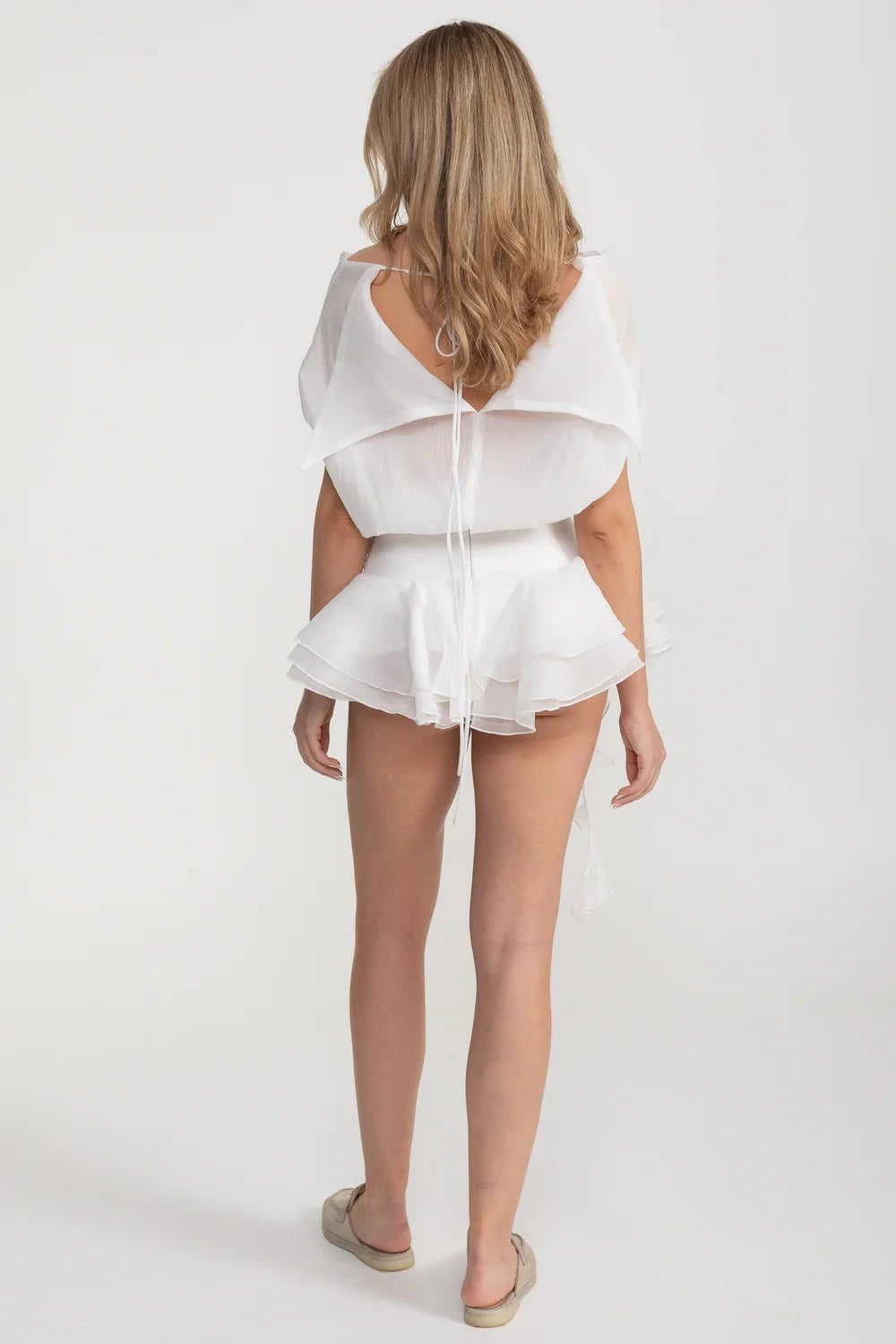 Elegant Mini Dress With Peplum Hem And Rosette Waist Embellishment - White