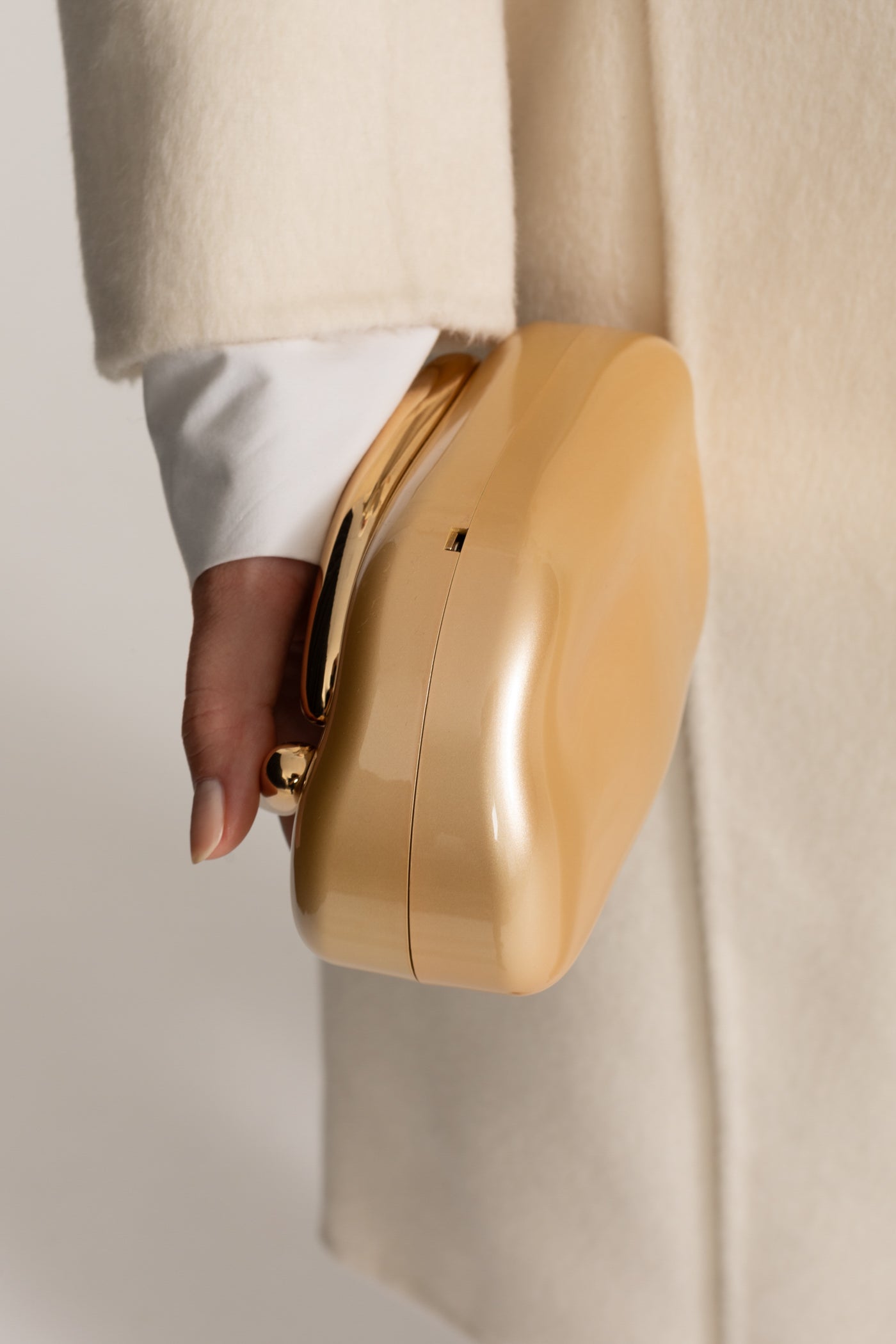 Clutch With Gold Sculptural Handle – Gold