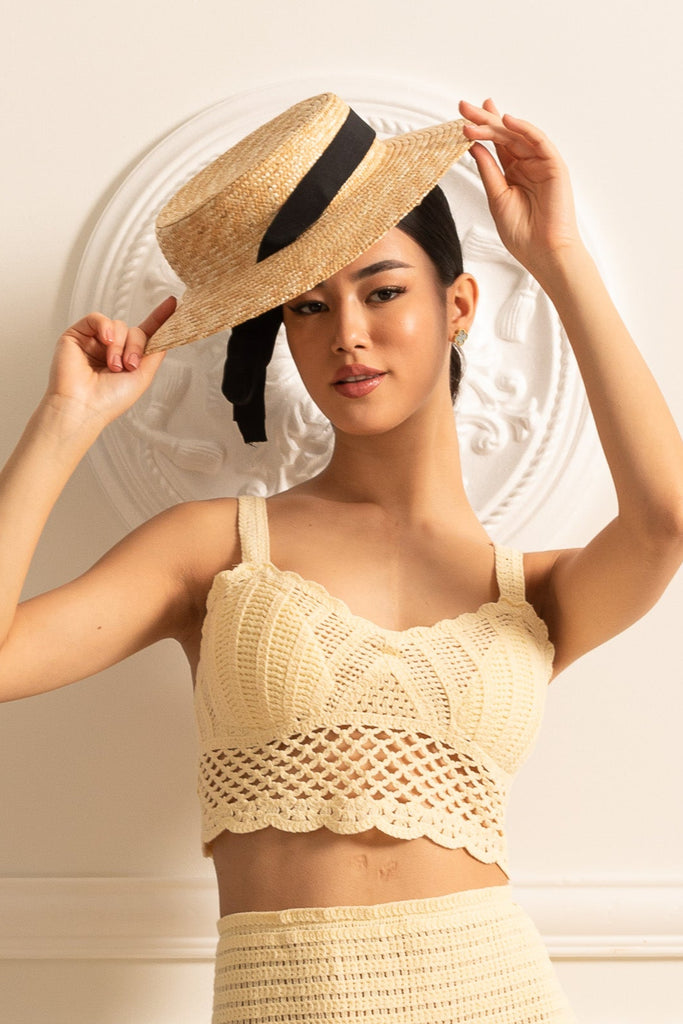 Wide-Brimmed Straw Hat With Black Ribbon Accent